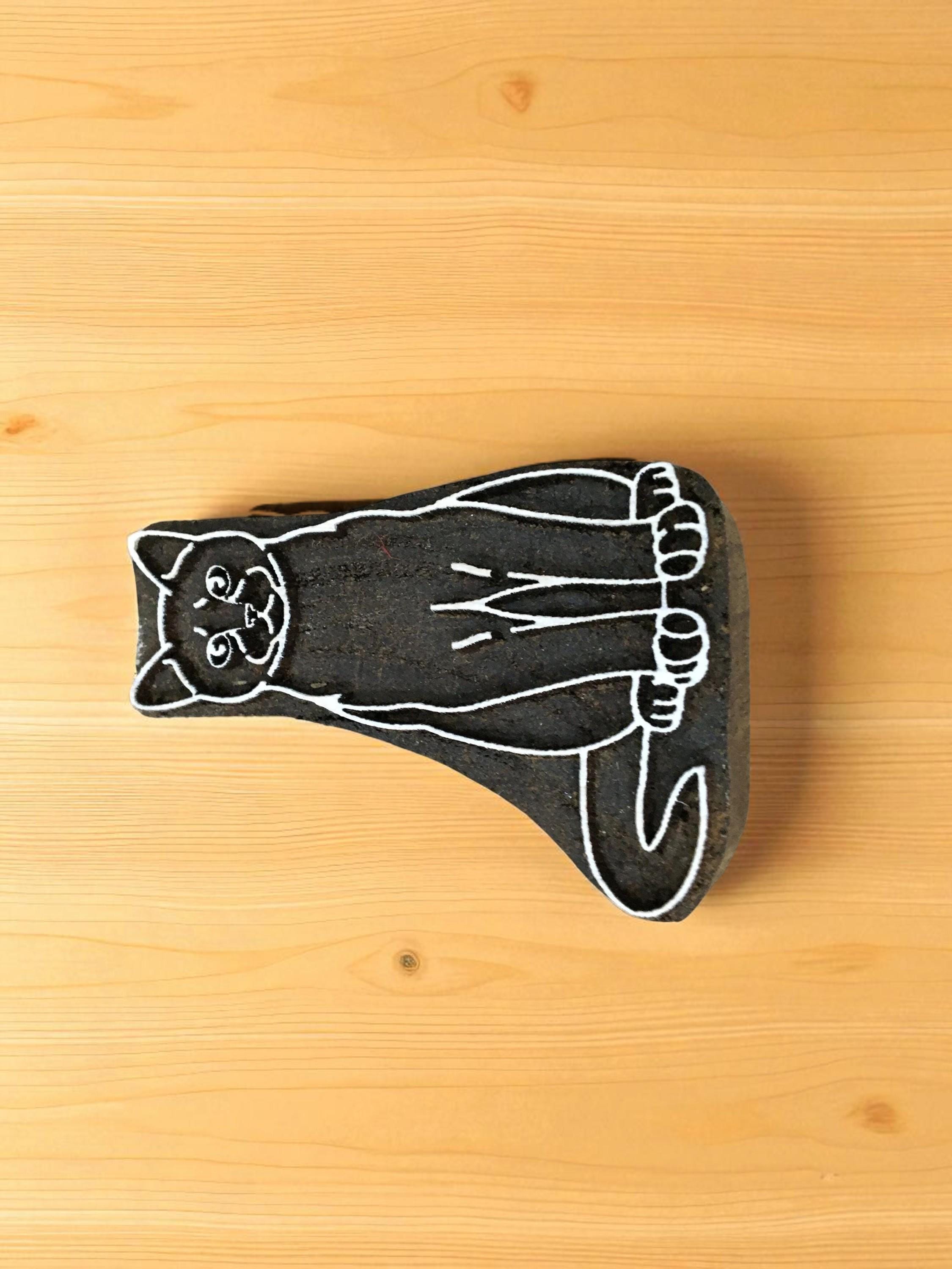 A sitting cat pottery stamp ceramic mould scrapbooking tjap batik printing floral carved stamps.