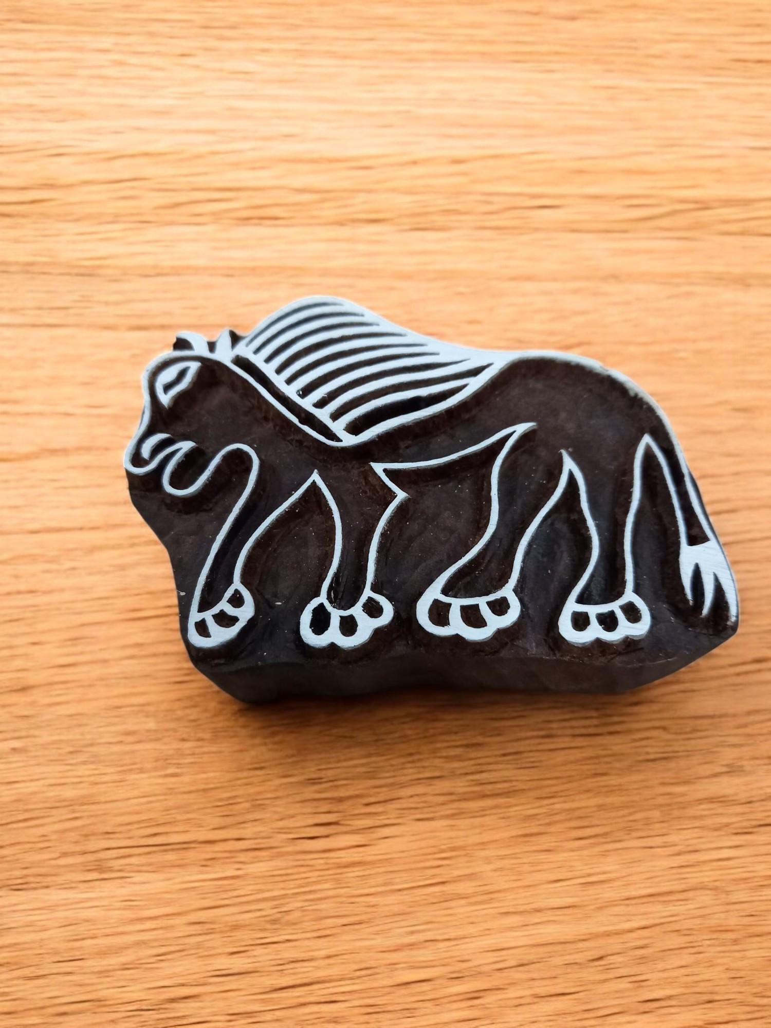 A Tribal Lion ,pottery stamp ceramic mold scrapbooking tjap batik printing floral carved stamps.