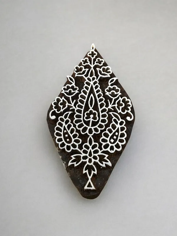 An Oriental Paisely  hand carved Indian wood printing block; textile stamp; pottery stamp,