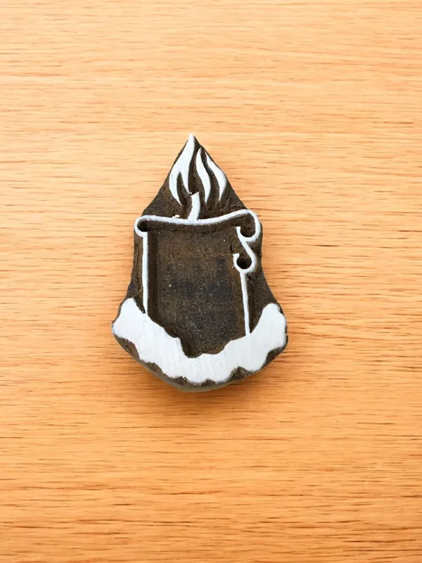 A lighted candle stamp
