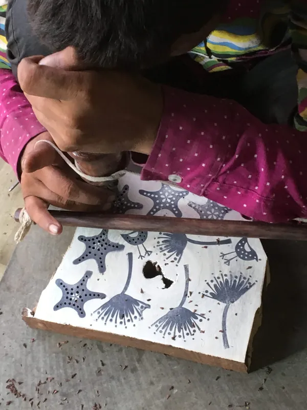 Block printed pattern drying on cloth in the workshop